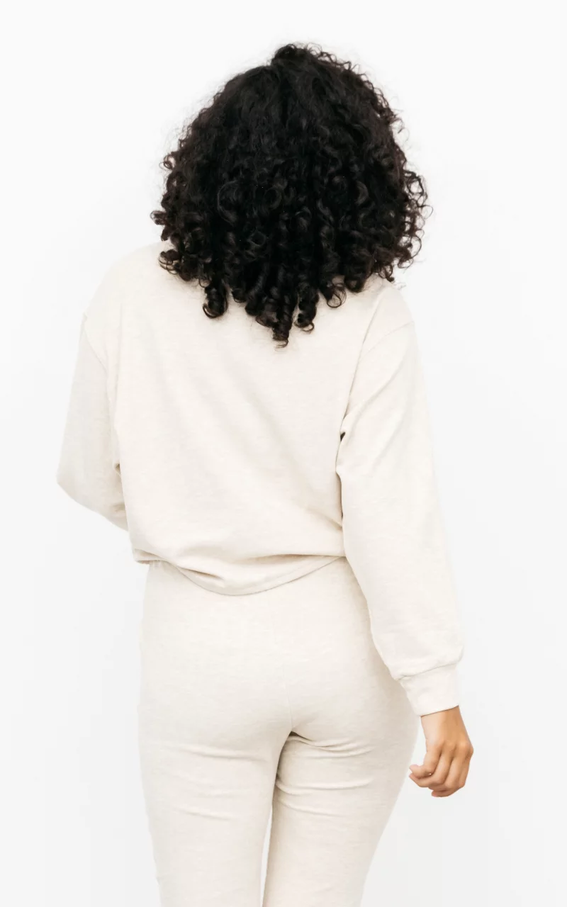 Set bestehend aus Hose und Pullover Creme