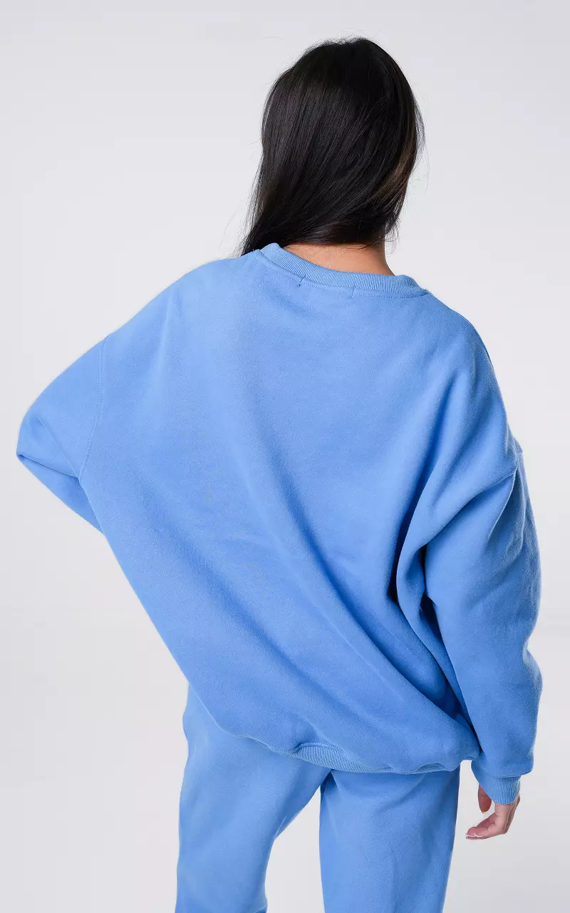 Oversized Pullover mit Text Blau