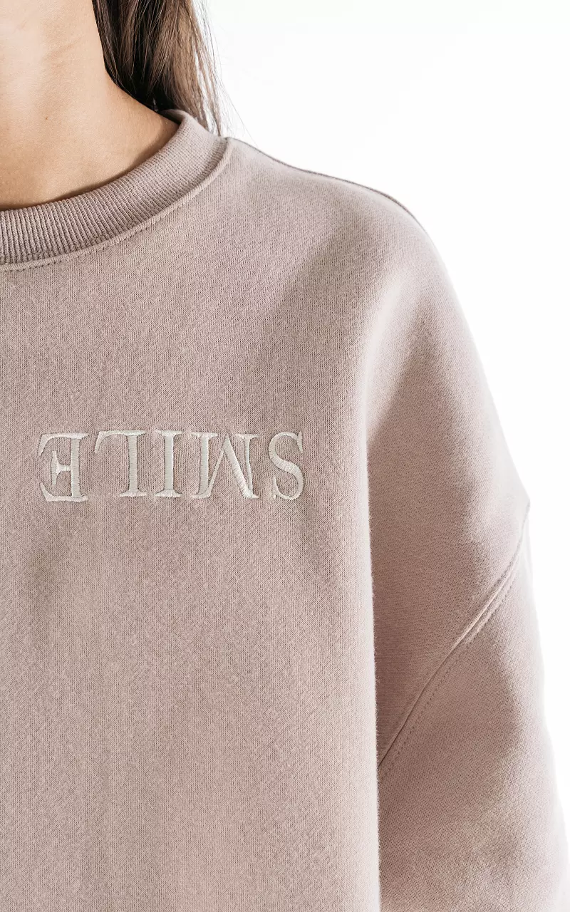 Oversized trui met tekst Beige