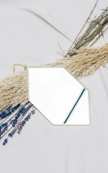 Gold coated mirror on a chain 