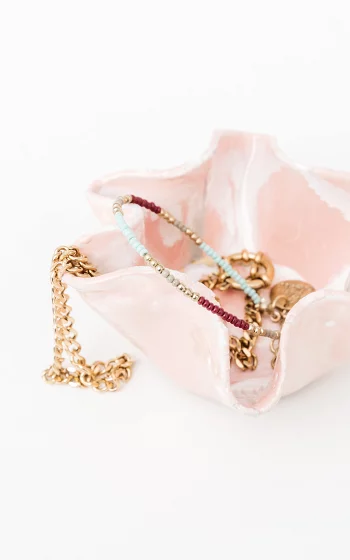 Dish with gold coloured details light pink white
