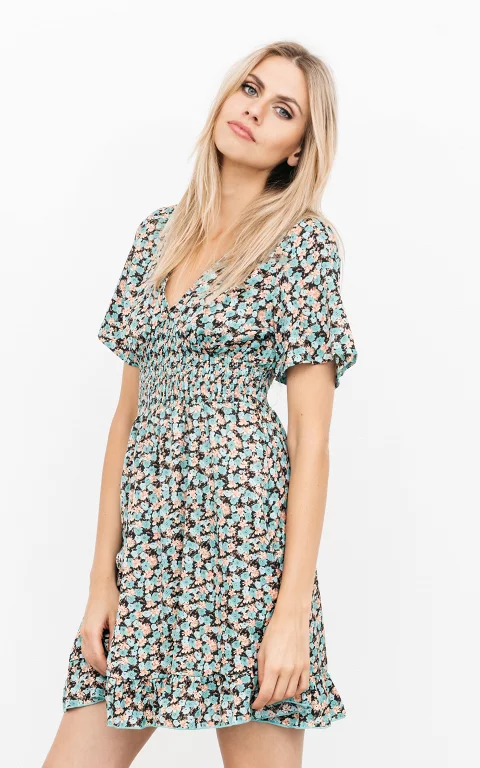 Patterned dress with pinched fabric 