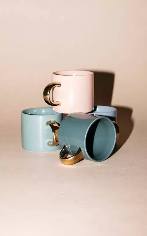 Ceramic mug with gold-coated ear 