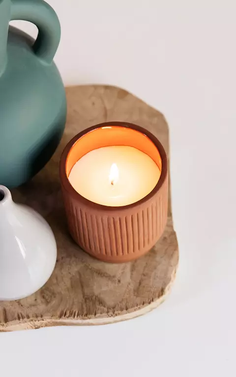 Candle in stone pot 