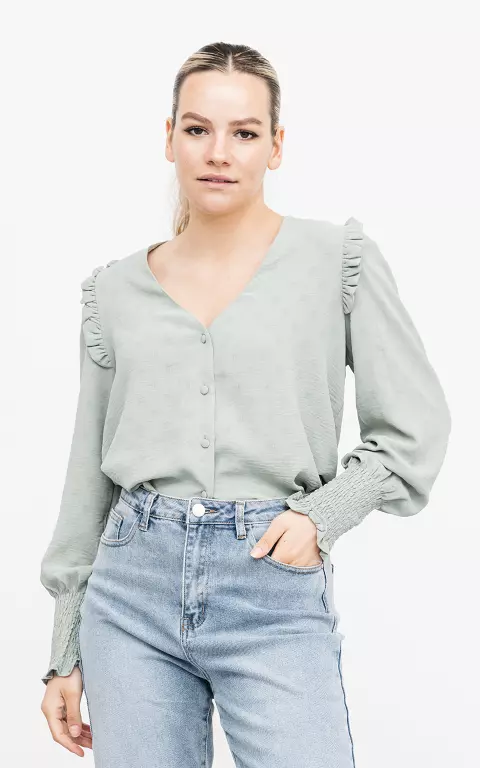 V-neck blouse with ruffles 