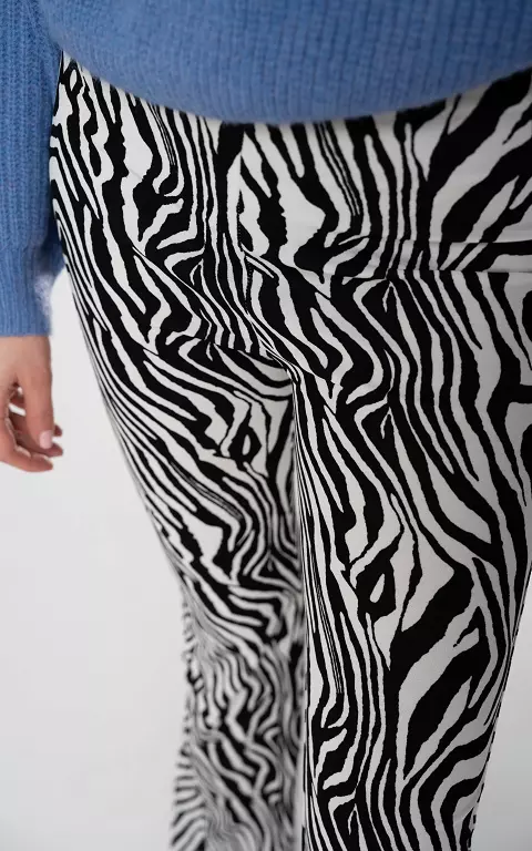 Flared trousers with zebra print white black