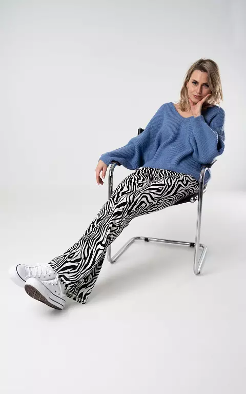 Flared trousers with zebra print 