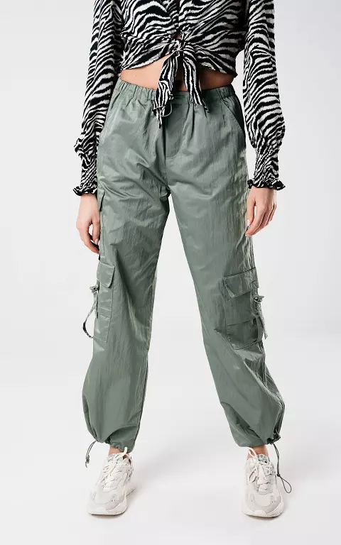 Parachute pants with silver-coloured details green